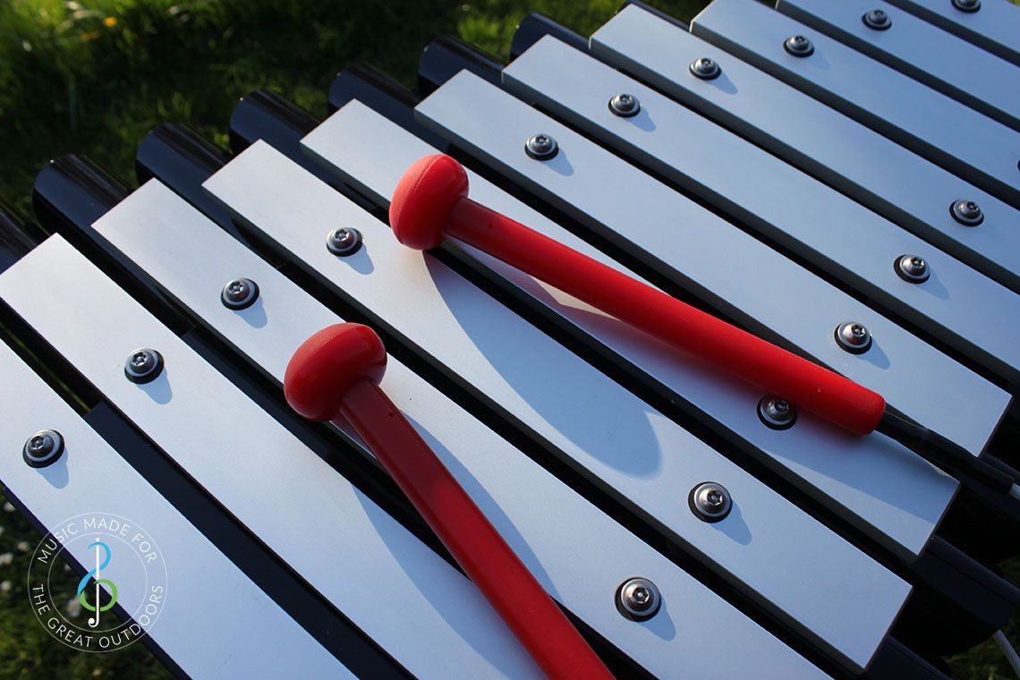 Close Up of Outdoor Xylophone Notes and Beaters