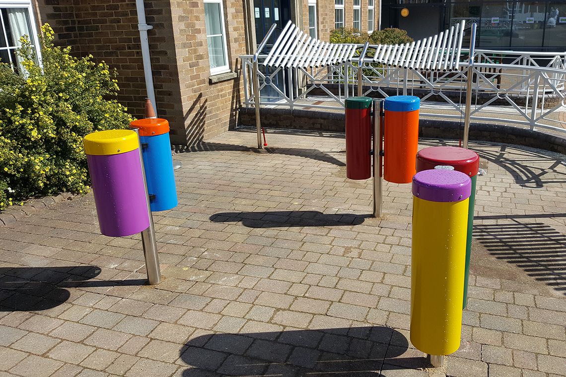 colourful outdoor drums on playground in treloars school